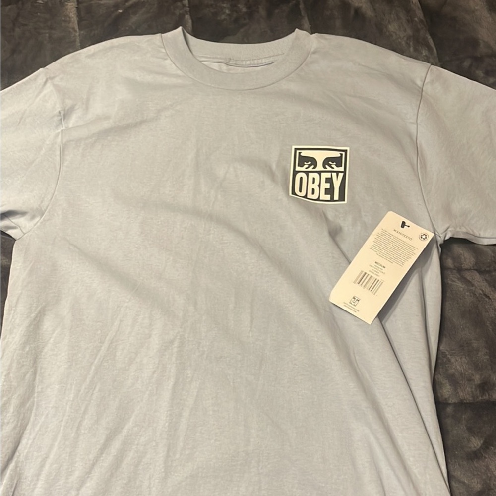 Blue OBEY T-Shirt.
